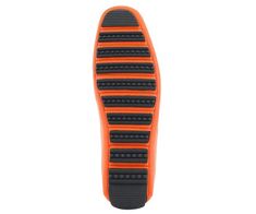 an orange shoe with black soles on a white background