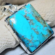 "Natural High Grade Kingman Arizona Turquoise Landscape Handmade Pendant set in .925 Sterling Silver ,1 1/2\" x 7/8\" with bail weighing 10 grams GH08. This is a handpicked natural stone, the exact one shown in picture.  The sterling silver is .925 and stamped.  Each piece is hand made by artisans in my shop. The quality of the stones and the silver workmanship is impressive.  Please look at other items in my store.  I sell ready-made jewelry with hand crafted silver work, pendants with a sterling silver bails and beautiful unique stones for jewelry wire wrapping and weaving. You will pay exact amount on shipping plus $1 for supplies and labor. All items are shipped within a couple of days after payment and are shipped USPS first class or international first class. Items are available for Collectible Turquoise Sterling Silver Necklace, Rectangular Turquoise Jewelry For Collectors, Collectible Rectangular Turquoise Jewelry, Turquoise Sterling Silver Rectangular Pendant Necklace, Turquoise Rectangular Pendant Necklace In Sterling Silver, Turquoise Sterling Silver Necklace With Rectangular Pendant, Collectible Blue Turquoise Necklace With Large Pendant, Blue Turquoise Necklace With Large Pendant, Collectible Blue Turquoise Gemstone Necklace