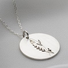 ❤️This elegant birth flower necklace features a round (coin) shaped pendant that has been expertly engraved with the birth flower of your choice. The intricate design showcases the beauty of nature, making it the perfect gift for anyone who loves botanical beauty. The pendant hangs from a delicate chain, adding a touch of sophistication to any outfit. Whether you wear it as a symbol of your birth month, or simply as a stunning piece of jewelry, this necklace is sure to become a cherished additio Minimalist Round Charm Necklace With Flower Charm, Round Flower Charm Necklace As Gift For Mom, Dainty Birth Flower Medallion Necklace, Flower Charm Necklace Gift, Round Disc Necklace With Flower Charm For Gift, Nature-inspired Flower Charm Round Pendant Necklace, Sterling Silver Birth Flower Medallion Jewelry, Birth Flower Round Disc Necklace For Anniversary, Personalized Birth Flower Medallion Necklace