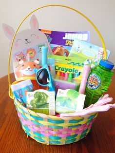 a basket filled with children's toys on top of a wooden table