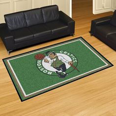 a living room with black couches and a green carpet that has a basketball player on it