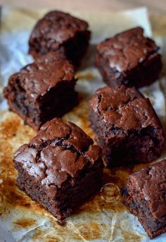 some brownies are on a piece of wax paper