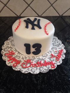 a decorated birthday cake with the number thirteen on it