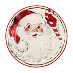 a plate with a santa clause holding a candy cane