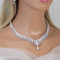 New to our Millennium collection, These beautiful romantic Enchanting Lotus Floral Vine Drop necklace is made of very fine quality of Swarovski crystals for your special day! Even we have hard time taking pictures because of their shine 😄 so we want to shine our brides on their special days. Simulated diamonds are also known as diamond simulants and include things like cubic zirconia (CZ), moissanite, and YAG. They can also include some natural clear gemstones like white sapphire, white zircon Exquisite Crystal Jewelry Sets For Celebration, Fine Jewelry Crystal Bridal Necklace For Wedding, Sparkling Crystal Bridal Necklace For Anniversary, Fine Crystal Bridal Necklace For Wedding, Crystal Bridal Necklace For Wedding, Diamond White Crystal Bridal Necklace For Celebration, Exquisite Crystal Jewelry Set With Sparkling Stones, Exquisite Jewelry Set With Sparkling Stones, Crystal Jewelry Sets With Sparkling Stones For Anniversary