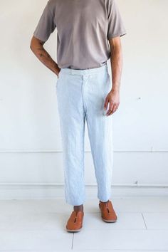 Vintage seersucker pants in a very light weight cotton. perfect for summer. these pants have some slight discoloration. they feature a zip fly adjustable side buttons at the waist and rear pockets.    - anthony is 6'2" with a 38" chest and a 31" waist. he normally wears a size medium shirt and 32 pants.    *measurements taken flat. Seersucker Pants, Striped Pants, Mens Trousers, Casual Pants, Casual Outfits, Trousers, Size Medium, Pants, How To Wear