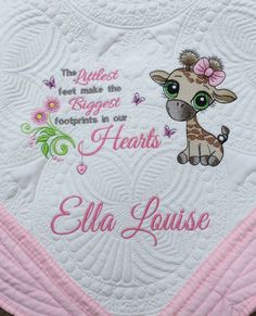 a pink and white blanket with a giraffe on it's side that says, the cutest buggies footprints in our hearts