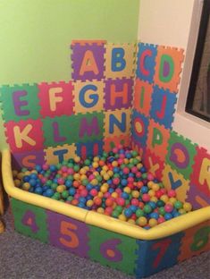 a child's play area with letters and numbers