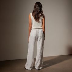 Our Wide Leg Relaxed Linen Pant is made in our classic lightweight linen that is breathable and soft. Style details include narrow jersey waistband with drawcord, front pleats, slash front pockets, back pockets, back darts, and a clean bottom hem. Garment dyed. Relaxed fit.Additional Information:• 100% Linen • Machine wash cold, tumble dry lowStyled With:• WVP3032 - Cotton Linen V Neck Vest • SWTSU8427 - Women's Suede Buckle Slide V Neck Vest, Linen Pant, Wide Leg Denim, Denim Pant, Linen Pants, Soft Style, Body Measurements, Cotton Linen, Wide Leg