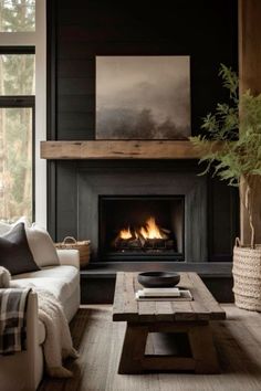 a living room filled with furniture and a fire place in the middle of the room