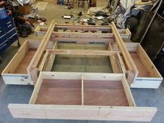 several wooden frames are being assembled in a workshop