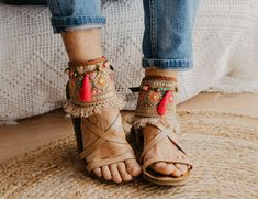 These Boho Sandals ankle belts will help you to completely transform any basic sandal into something stylish and unique. They are made with carefully selected ethnic materials, in a completely handmade process. With them, you will get those sandals that you wear everywhere and have super comfortable, have a different air when you want. In this way, you can enhance that Boho-Chic style that we love so much. This ad is for a pair of anklets, footwear is not included. If you need a custom design or for a girl, do not hesitate to write to me and we will design it together. The anklets are adjustable to fit a variety of widths. Handmade design Made with old trimmings from India, there are only 5 units available Adjustable leather straps Measurements for decorative part of the anklet are approx: Bohemian Flat Sandals For Beach Season, Bohemian Flat Heel Sandals For Beach Season, Summer Festival Sandals With Flat Heel, Closed Toe Sandals For Summer Festivals, Bohemian Flat Heel Sandals For Vacation, Summer Festival Sandals With Single Toe Strap, Ankle Strap Barefoot Sandals For Beach Vacation, Summer Barefoot Sandals With Closed Toe For Vacation, Bohemian Round Toe Sandals For Beach Season