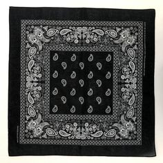 a black bandana with paisley designs on it