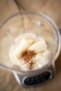 the blender is full of ingredients to make banana slices and powdered sugars