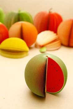 several pieces of fruit sitting on top of a table