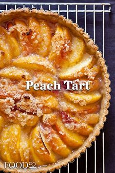 a peach tart on a cooling rack with the words peach tart above it