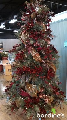 a christmas tree with red and gold decorations