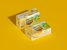 two boxes of butter on a yellow background