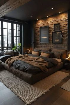 a large bed sitting in the middle of a living room next to a brick wall