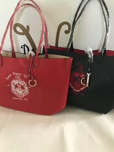 two harry potter handbags sitting next to each other