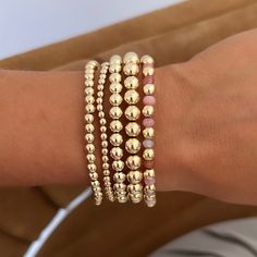 14k gold filled stack of 5 ball bracelets 2x4mm 1x6mm 1x7mm 1x8mm Elastic stretch A bundle and save product! Water resistant! Hypoallergenic 14k Gold Beaded Bracelets With Round Beads, Hypoallergenic 14k Gold Beaded Bracelets, Stacked Round Beads Jewelry For Gift, Stacked Round Beads Jewelry As Gift, Stacked Round Beads Jewelry Gift, 14k Gold Filled Spacer Beads Jewelry, 14k Gold Filled 8mm Round Bead Bracelets, 14k Gold Beaded Bracelet With Spacer Beads, 14k Gold-filled Bracelets With 8mm Beads