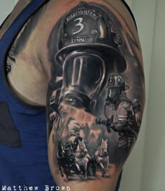 a man with a fireman's helmet on his arm