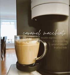 a cup of coffee sitting on top of a counter