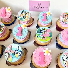 cupcakes are decorated with cartoon characters and numbers