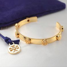 Tory Burch Milgrain Raised Logo Cuff Bracelet In Gold Tony Burch, Etruscan Jewelry, Material Gworl, Tory Burch Bracelet, Tory Burch Jewelry, Jewelry Accessories Ideas, Accessories Ideas, Stacked Jewelry, Jewelry Pouch