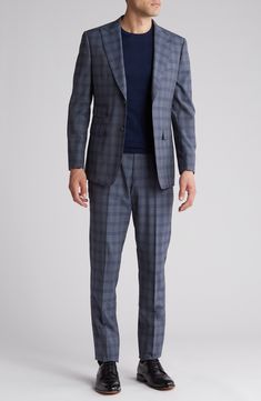 Sophisticated peaked lapels smarten the jacket of this trim-fit suit crafted from a fine wool blend and finished in a handsome windowpane plaid print. 36 1/4" inseam; 7 3/4" leg opening; 10 1/2" rise (size 38R) Jacket has peaked lapels; chest welt pocket; front flap pockets Unhemmed Lined 90% wool, 10% polyester Dry clean Imported Windowpane Plaid, Trim Fit, Fitted Suit, Suit Separates, Plaid Print, Welt Pocket, Nordstrom Rack, Wool Blend, Two Piece