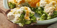 broccoli and chicken casserole in a bowl with a wooden spoon