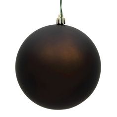 a black ball ornament hanging from a string