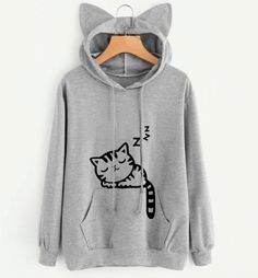 Soft Kitty, Sweet Kitty, Little Ball of Fur.... This adorable hoodie features a hood with cat ears and an adorable sleeping kitten print. Comes in four fun colors. Made with a cotton blend. Kawaii Hoodies, Estilo Harajuku, Harajuku Women, Cat Hoodie, Loose Pullover, Cat Ear, Sweatshirt Women, Women Hoodies Sweatshirts, Cat Pattern