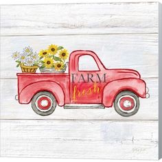 an old red truck with sunflowers in the back and farm fresh written on the side