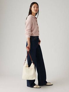 Our Bucket Bag was crafted with durable cotton and features two shoulder straps with a roomy interior. A durable bucket bag With two shoulder straps Features a roomy interior White Levis, Levis Women, First Lady, Levi's Jeans, White Bag, Shoulder Straps, Bucket Bag, The Original, Levi's