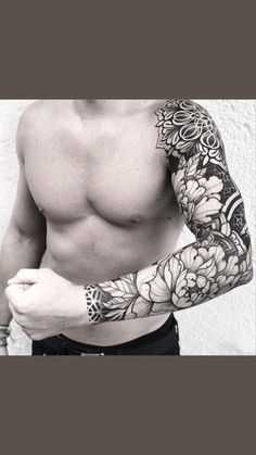 a man with tattoos on his arm and chest