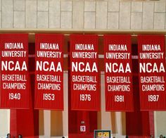 several banners with the names of basketball teams on them