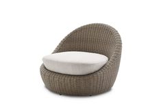 an outdoor lounge chair with a cushion on the back and seat pad in grey wicker