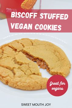 a close up of a cookie on a plate with the words biscoff stuffed vegan cookies