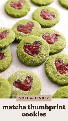 soft and tender matcha thumbprint cookies with raspberry jam in the middle