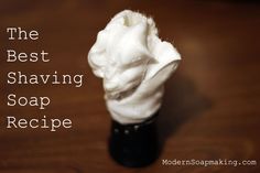 the best shaving soap recipe is made with whipped cream in a black bottle on a wooden table