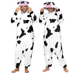 two people in onesuits that look like cows