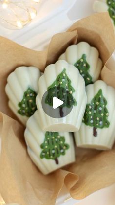 some white chocolates with green trees on them