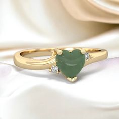 Delicate and dainty, this 14K Gold ring is a lovely way to express the love within you. A heart shaped dusty green jade is the focus of this ring, with two sparkling diamonds. It creates an elegant look that is not overstated, and is beautiful on the hand. It is perfect as an everyday ring and an excellent choice for a promise ring as well.  Gem: Genuine Jade Metal: solid 14K Gold Diamonds: genuine SI2 diamonds Free gift packaging is included with every order. Sage Wedding, Dusty Green, Everyday Ring, Diamond Free, Everyday Rings, 14k Gold Ring, Green Jade, Multi Stone Ring, Jade Green