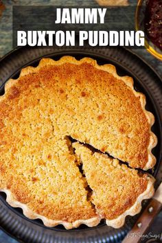 a pie that has been cut into pieces with the words jimmy buxton pudding on it