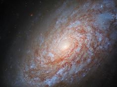 an image of a spiral galaxy in the night sky, taken from earth looking down on it