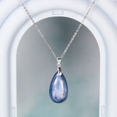 This elegant blue Kyanite teardrop pendant necklace is like a raindrop from heaven, the stone has a beautiful texture in blue green color. It's simple, yet elegant, and will be a great accent on your everyday outfit. Experience the beauty of nature with this stunning blue Kyanite pendant necklace! The unique teardrop design and vibrant blue-green color make it a truly eye-catching piece. Elevate any outfit with the simple yet elegant touch of this luxurious necklace. Each time you wear it, you'l Blue Sterling Silver Teardrop Pendant Necklace, Blue Teardrop Pendant Necklace In Sterling Silver, Elegant Blue Teardrop Drop Necklace, Blue Minimalist Teardrop Pendant Jewelry, Blue Teardrop Pendant Minimalist Jewelry, Minimalist Blue Teardrop Pendant Jewelry, Sapphire Drop Necklace For Gift, Blue Gemstone Teardrop Pendant Necklace, Sapphire Drop Necklaces For Gifts