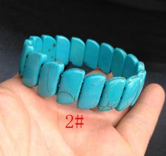 "howlite turquoise stone bracelet,bangle 1.Material: howlite turquoise , gemstone beads, stretch cord 2. size of bead, 1# approx 6mmx32mm in size. Length: 8\", width: 32mm 2# approx 10mmx18mm in size. Length: 8\", width: 18mm 3# approx 8mmx30mm in size. Length: 8\", width: 30mm 4# approx 12mmx32mm in size. Length: 8\", width: 32mm 5# approx 10mmx22mm in size. Length: 8\", width: 22mm 3.This price is one bracelet 4. notice: I try my best to make the pictures true, but there will still be color de Turquoise Howlite Beaded Bracelets As A Gift, Turquoise Stretch Bangle Bracelet As Gift, Turquoise Stretch Bangle Bracelet For Gift, Turquoise Hand-strung Stretch Bangle Bracelet, Turquoise Howlite Gemstone Beads Bracelets, Turquoise Howlite Bracelets With Natural Stones, Turquoise Natural Stone Bracelets, Turquoise Stone Bracelet, Bracelet Man