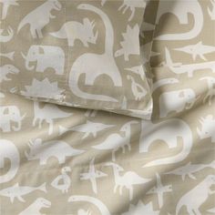 an elephant print sheet set with two pillows