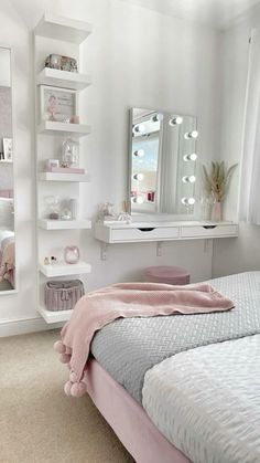 a bedroom with a bed, mirror and shelves on the wall above it's headboard